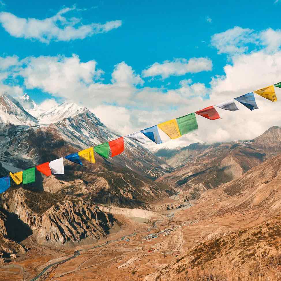 Flags over snowcapped moutnains